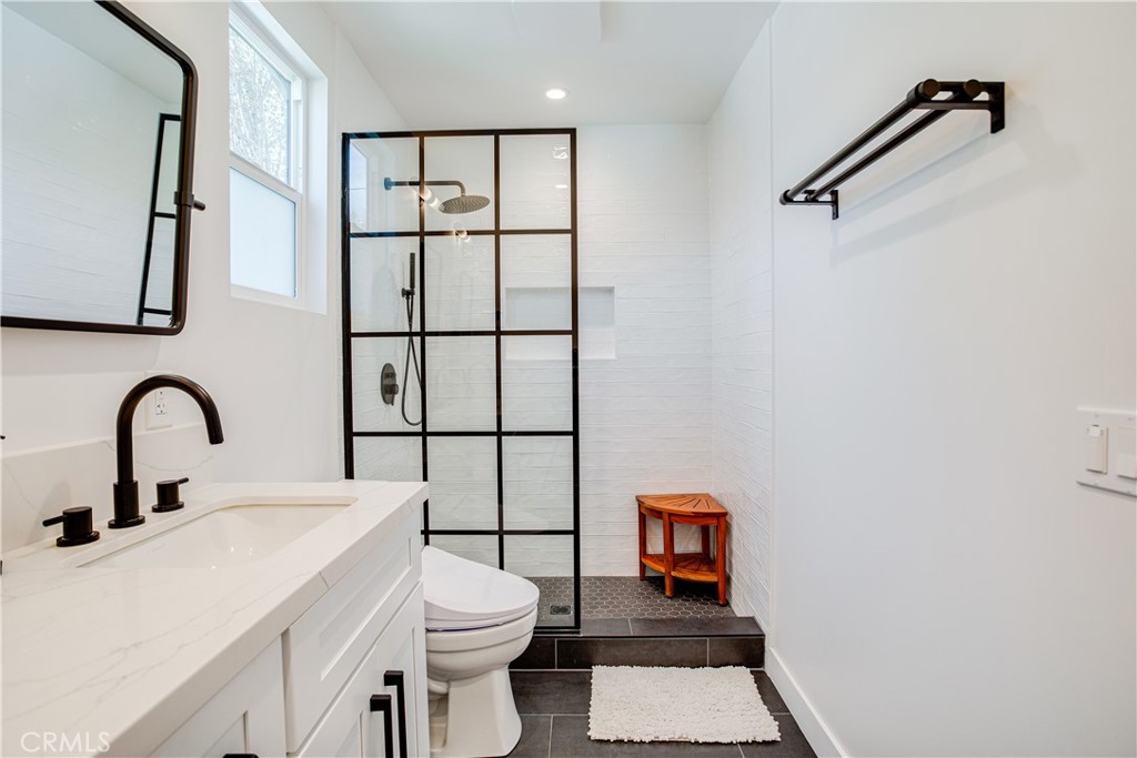 517 Davis Avenue Glendale, CA 91201 - Photo 15 of 18 a bathroom with a toilet sink and mirror