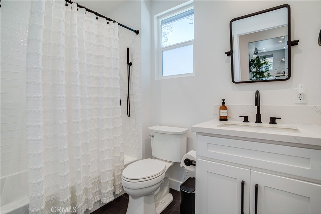 517 Davis Avenue Glendale, CA 91201 - Photo 17 of 18 a bathroom with a toilet sink and mirror