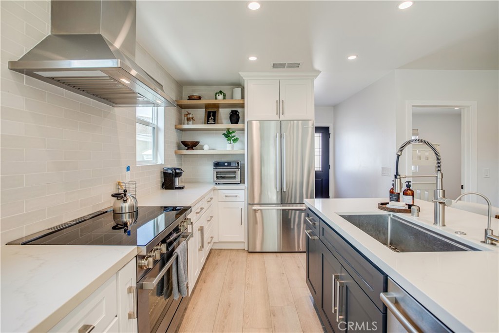 517 Davis Avenue Glendale, CA 91201 - Photo 5 of 18 a kitchen that has a sink a stove and a refrigerator
