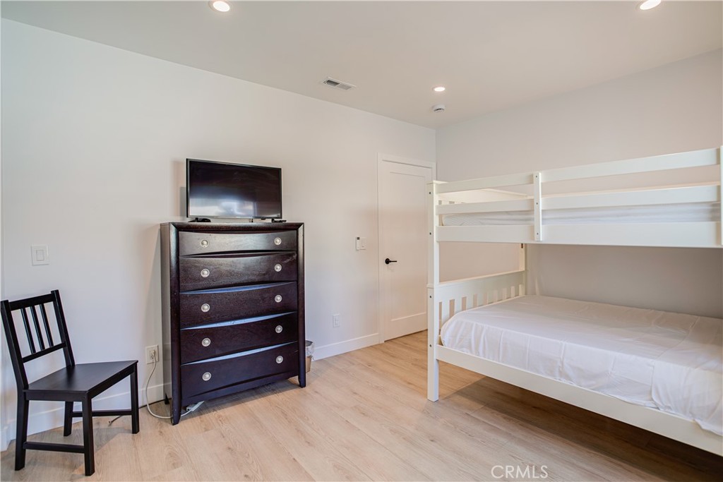 517 Davis Avenue Glendale, CA 91201 - Photo 10 of 18 a bedroom with a bed and a television