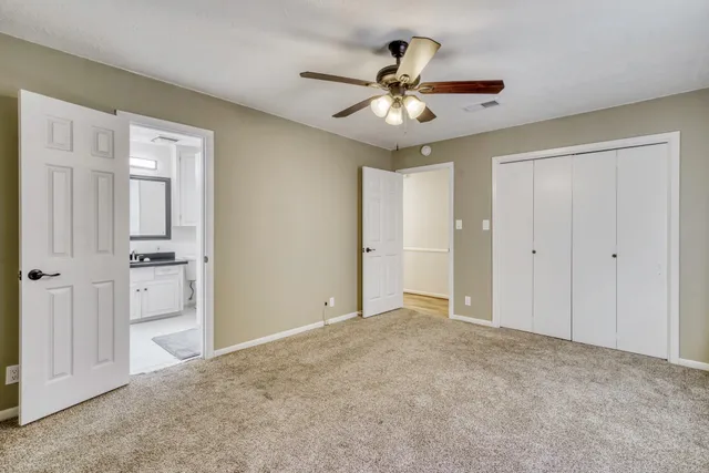 a bathroom with a sink vanity and a mirror