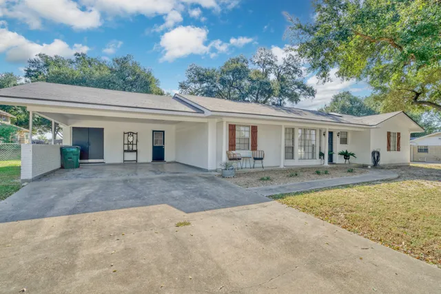 front view of a house with a patio
