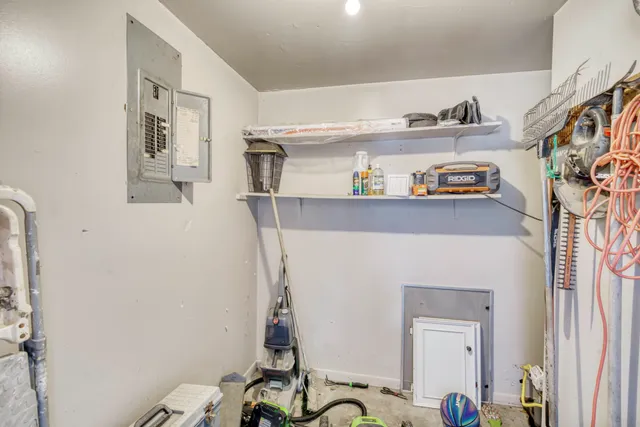 a bathroom with a refrigerator and a sink
