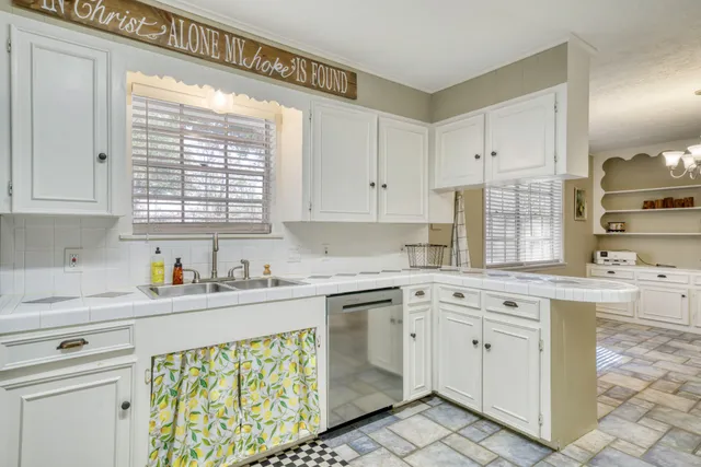 a kitchen with appliances and cabinets