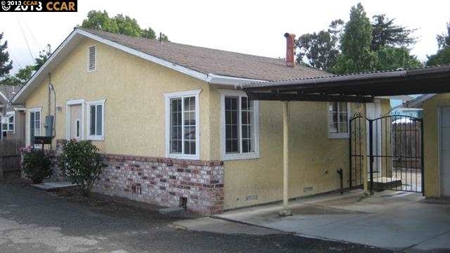 617 Rodeo Avenue Rodeo, CA 94572 - Photo 1 of 1 a front view of a house with a garage
