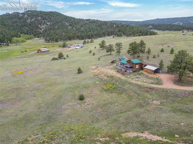 608 Slater Creek Road Guffey, CO 80820 - Photo 5 of 47 Aerial view of sparsely populated area with a forest