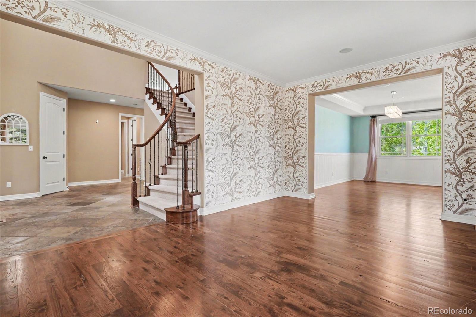 791 Elk Rest Road Evergreen, CO 80439 - Photo 6 of 46 a view of an entryway with wooden floor