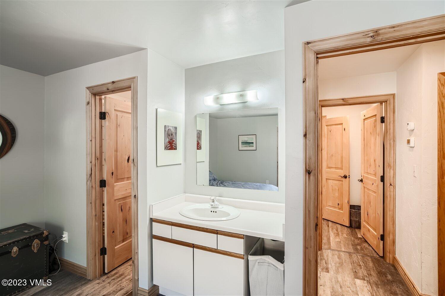 963 Lions Ridge Loop, Unit 503 Vail, CO 81657 - Photo 14 of 28 a bathroom with a sink a mirror and a shower
