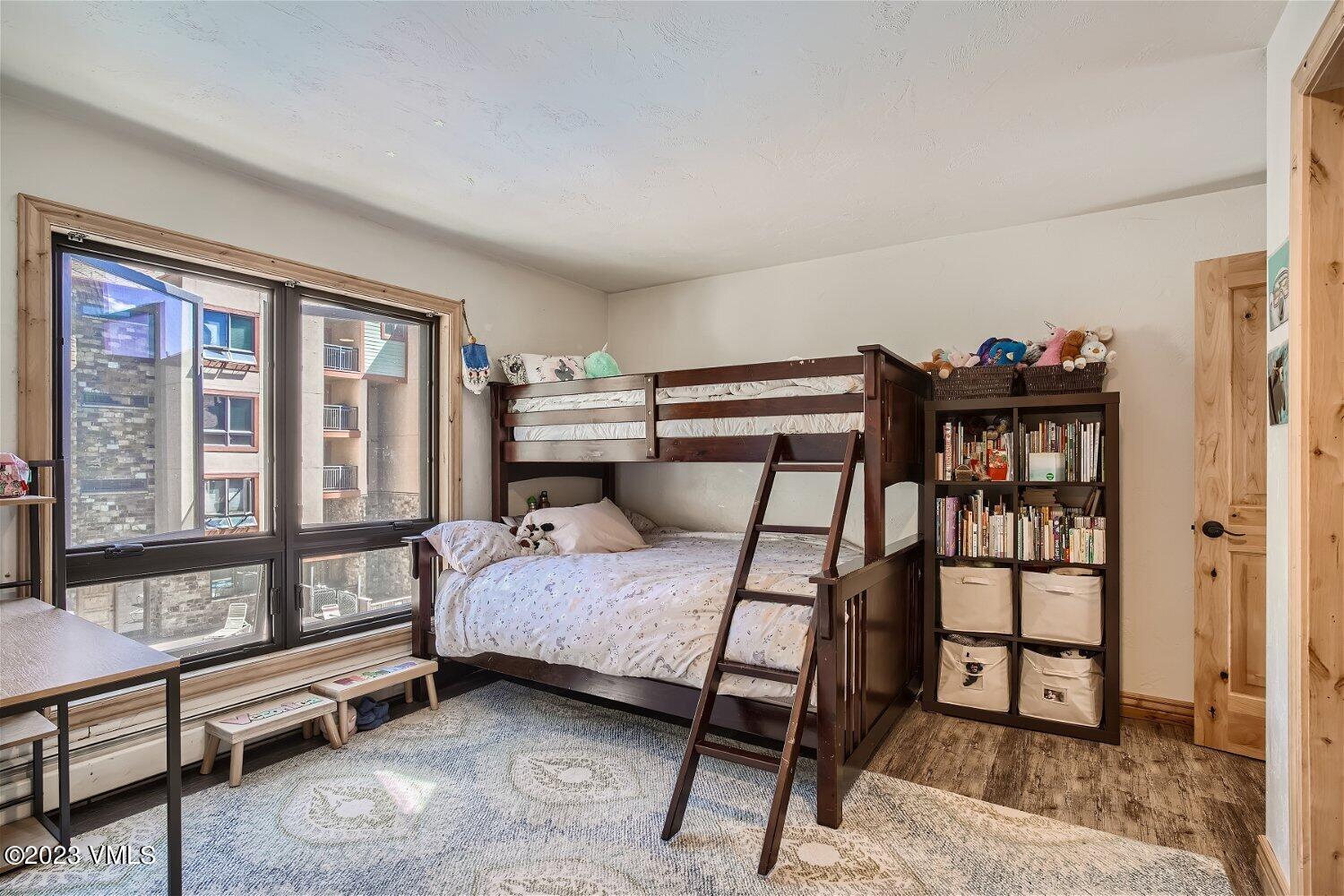 963 Lions Ridge Loop, Unit 503 Vail, CO 81657 - Photo 16 of 28 a bedroom with a bed and a window