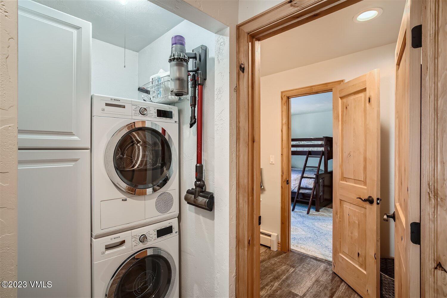 963 Lions Ridge Loop, Unit 503 Vail, CO 81657 - Photo 19 of 28 a view of a hallway with washer and dryer