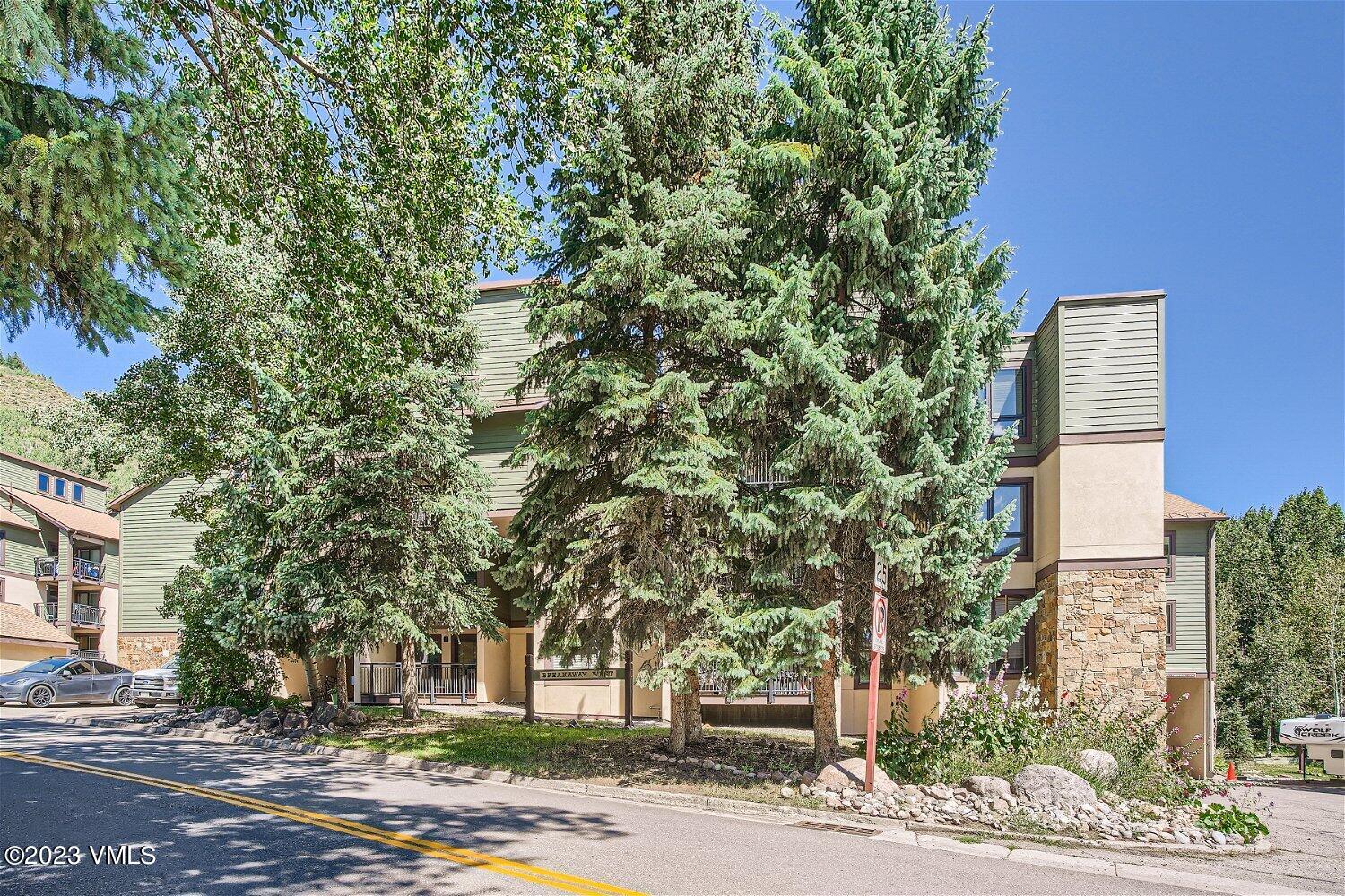 963 Lions Ridge Loop, Unit 503 Vail, CO 81657 - Photo 24 of 28 a street sign on a sidewalk next to a road