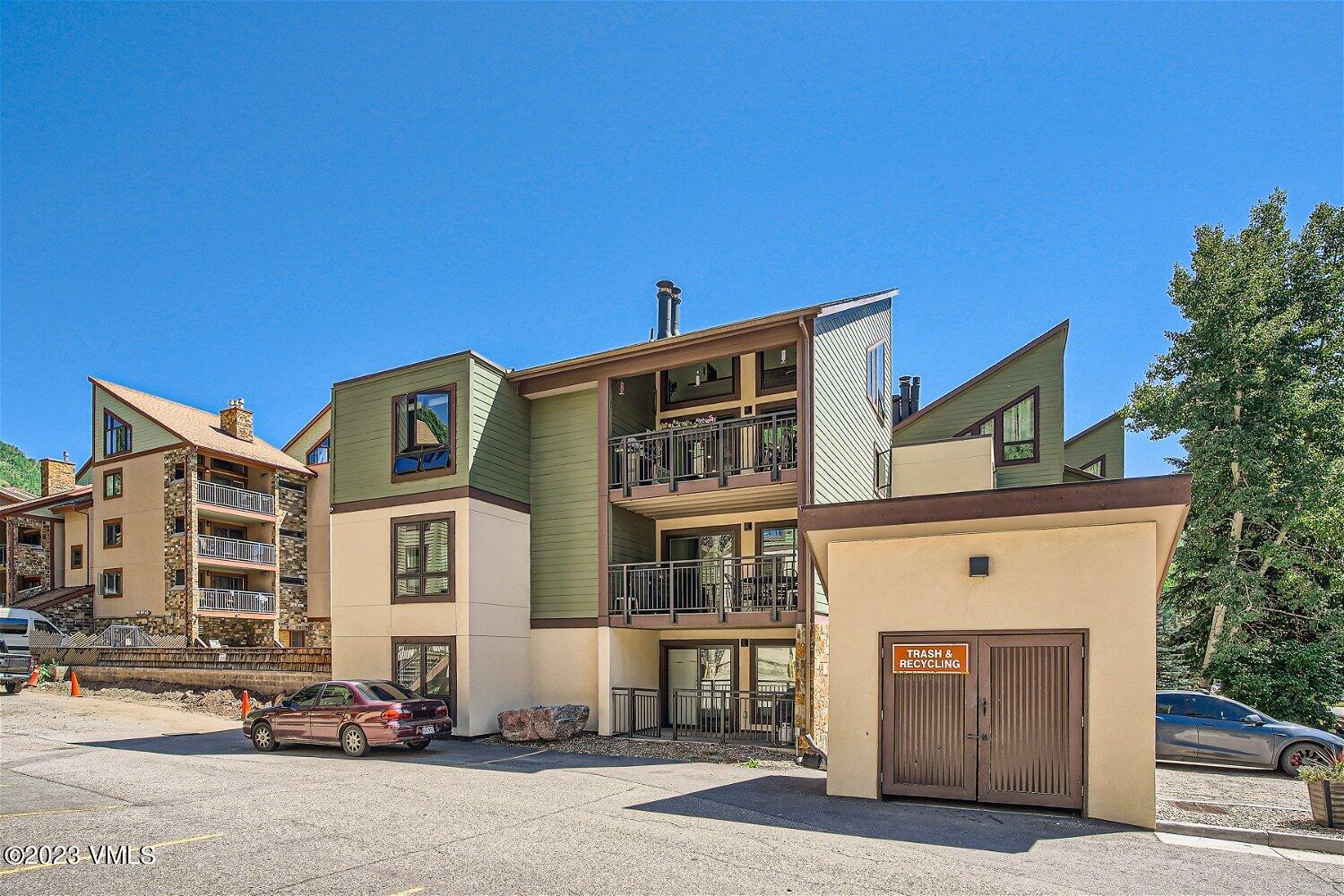 963 Lions Ridge Loop, Unit 503 Vail, CO 81657 - Photo 26 of 28 a front view of a building with parking