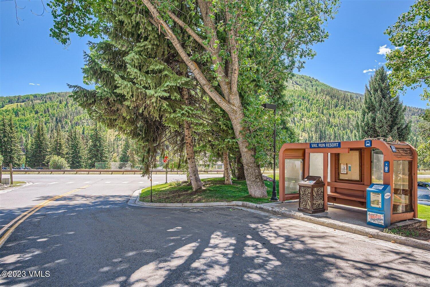 963 Lions Ridge Loop, Unit 503 Vail, CO 81657 - Photo 28 of 28 a view of a house with backyard and a tree
