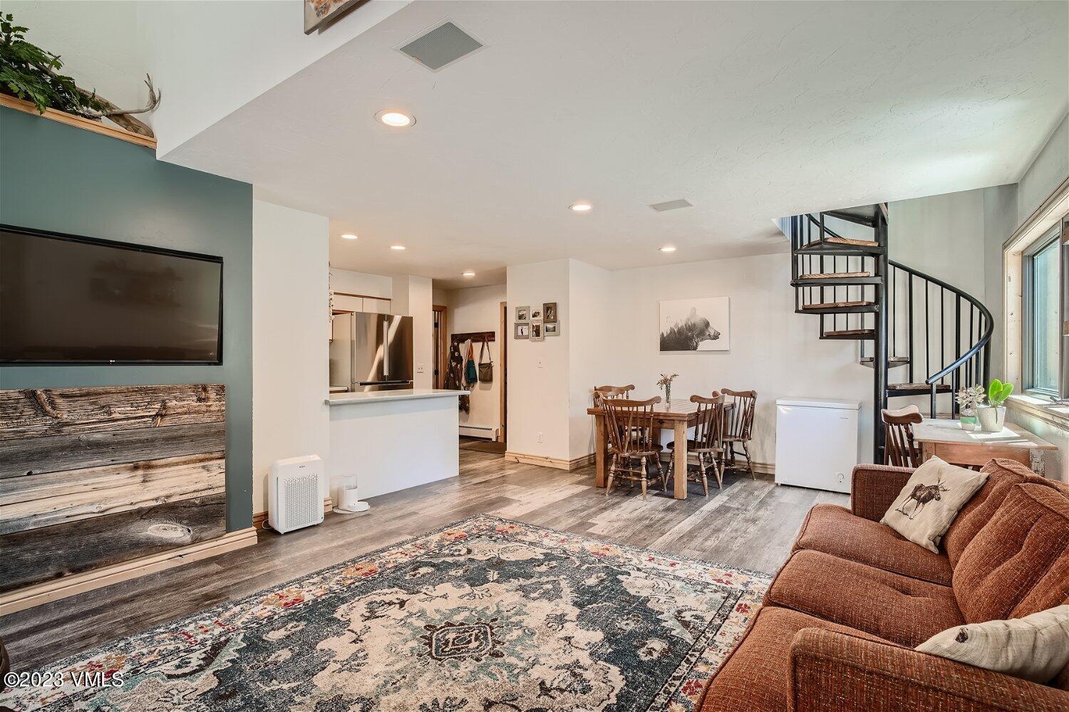 963 Lions Ridge Loop, Unit 503 Vail, CO 81657 - Photo 6 of 28 a living room with furniture and a flat screen tv