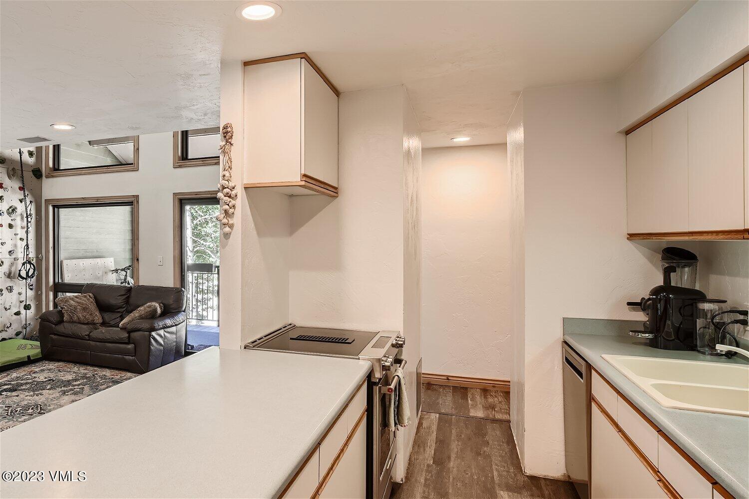 963 Lions Ridge Loop, Unit 503 Vail, CO 81657 - Photo 10 of 28 a kitchen with a refrigerator and a stove top oven
