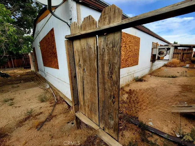 a view of a house with a tree
