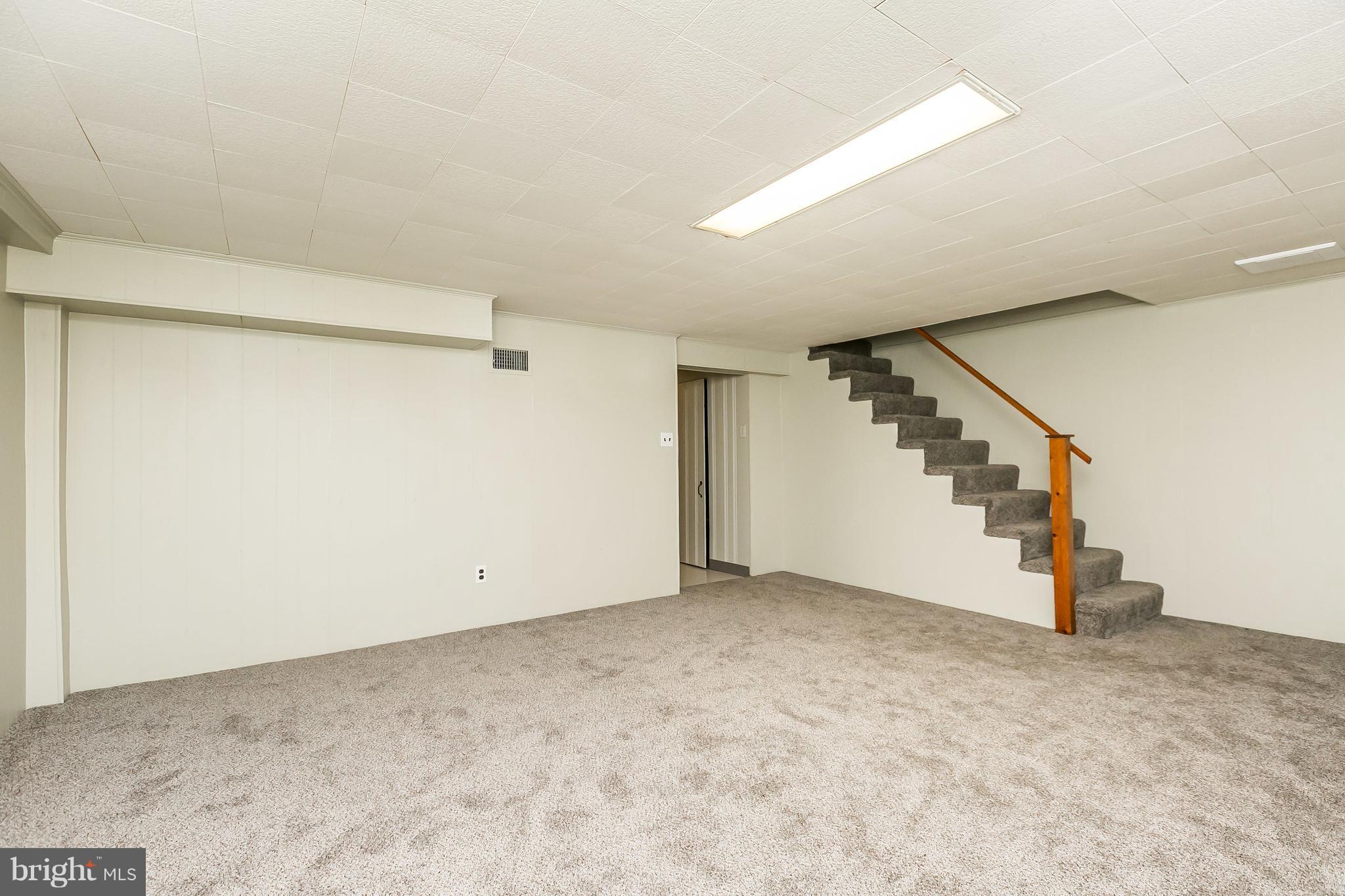 6135 Regent Park Road Baltimore, MD 21228 - Photo 22 of 30 Family Room freshly carpeted in 2018
