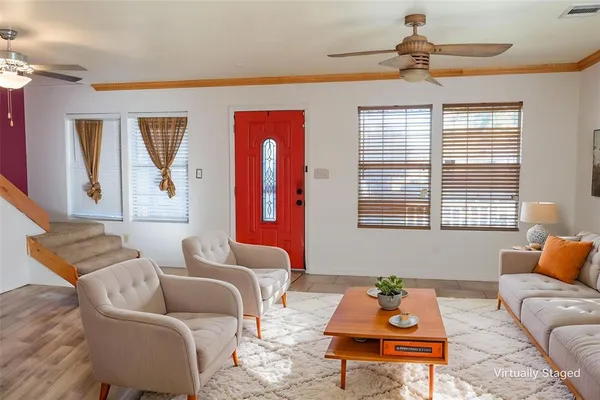 a living room with furniture and a window