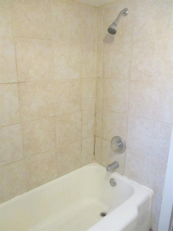 1501 3rd Avenue Beaver Falls, PA 15010 - Photo 16 of 19 a white bath tub sitting in a bathroom and a shower