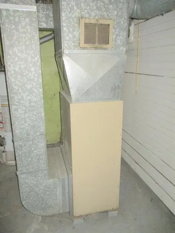 a bathroom with a granite countertop shower and a sink