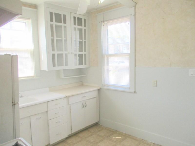 1501 3rd Avenue Beaver Falls, PA 15010 - Photo 10 of 19 a room with a white cabinets and a window