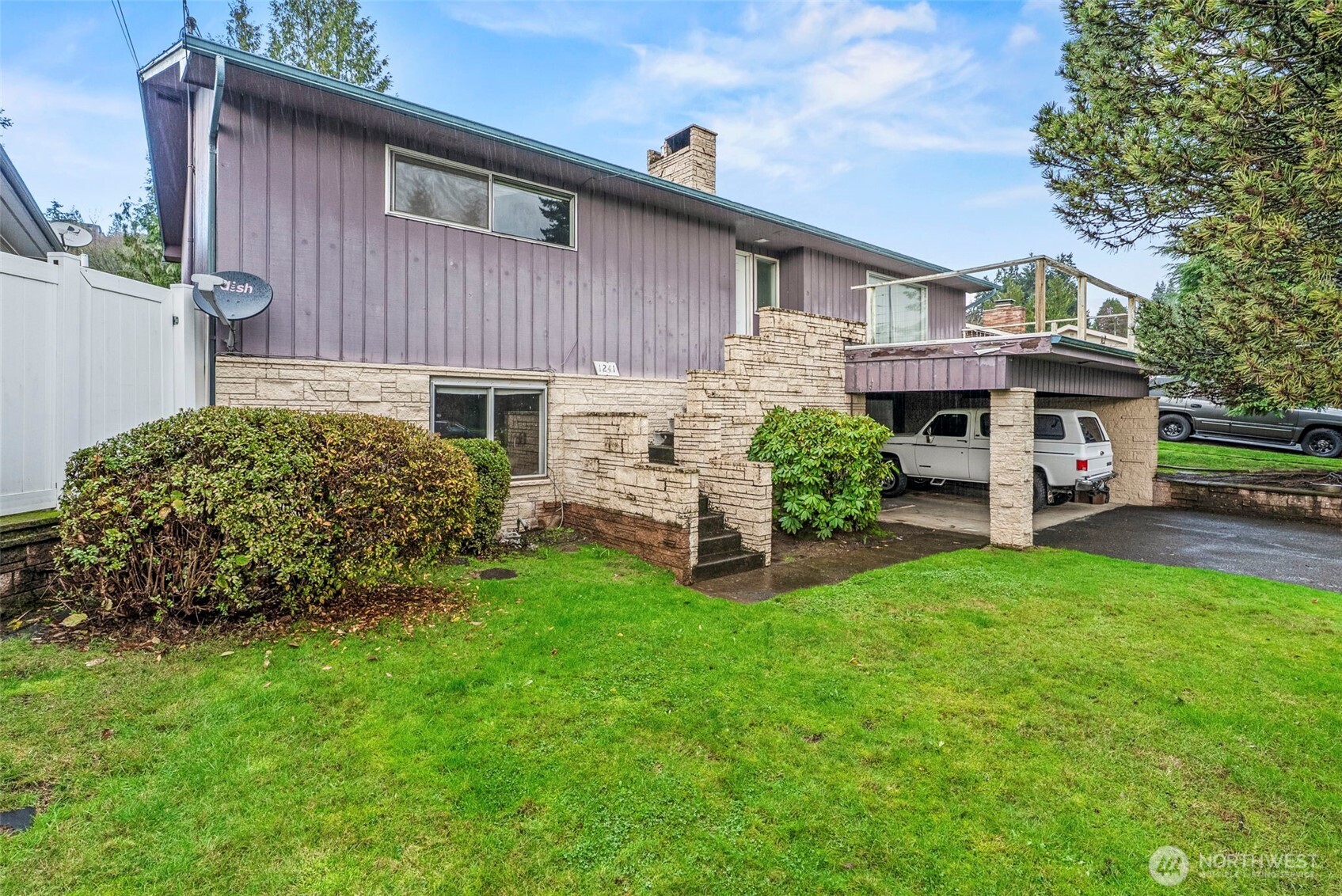 a view of a house with a yard porch and sitting area