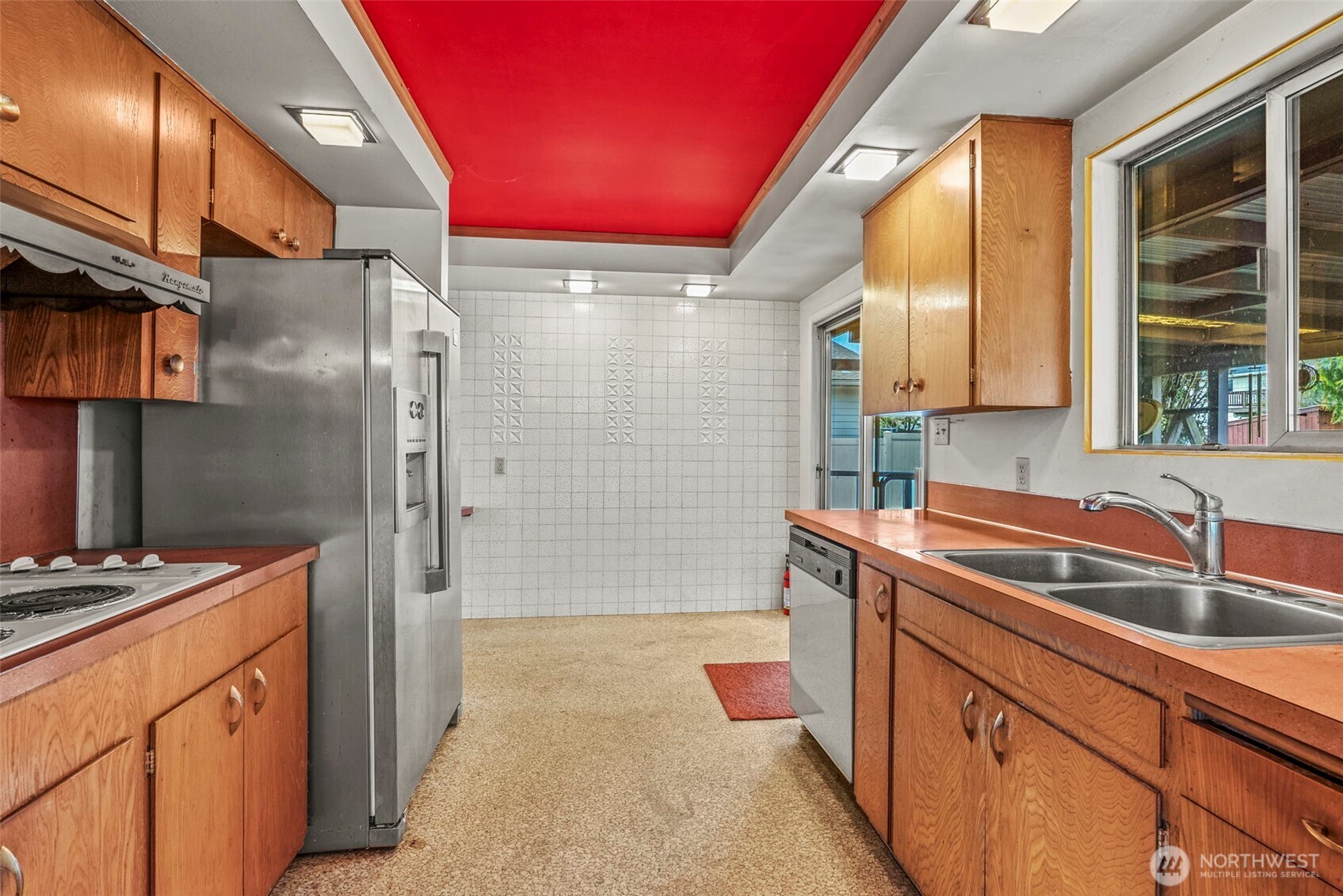 1241 Spruce Street Longview, WA 98632 - Photo 15 of 26 a kitchen with stainless steel appliances granite countertop a sink stove and refrigerator