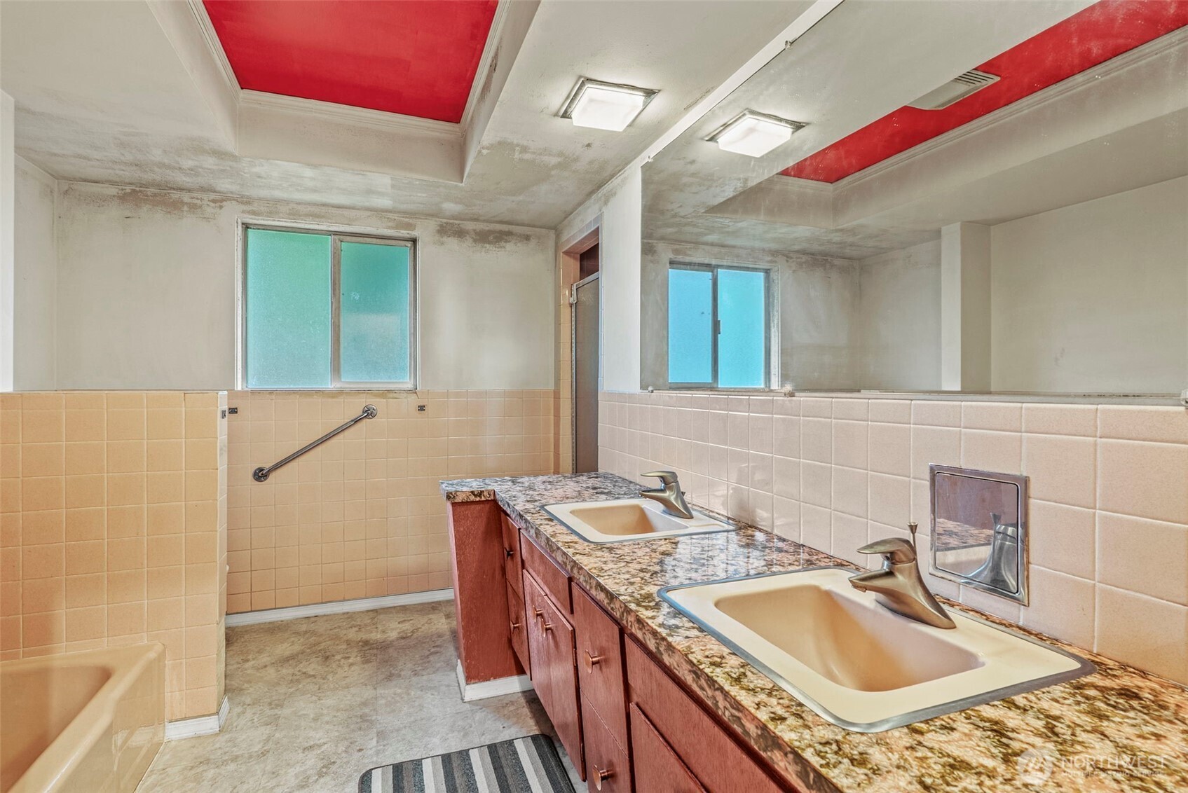 1241 Spruce Street Longview, WA 98632 - Photo 20 of 26 a bathroom with a sink vanity granite tub shower and a mirror