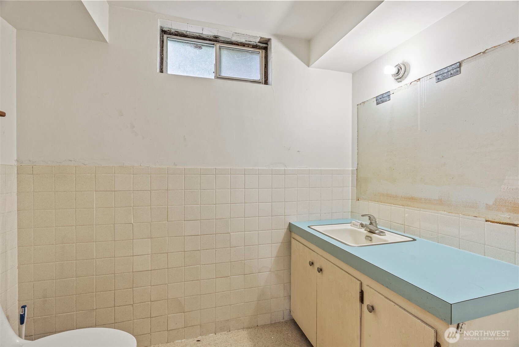 1241 Spruce Street Longview, WA 98632 - Photo 9 of 26 a bathroom with a granite countertop sink a toilet and shower