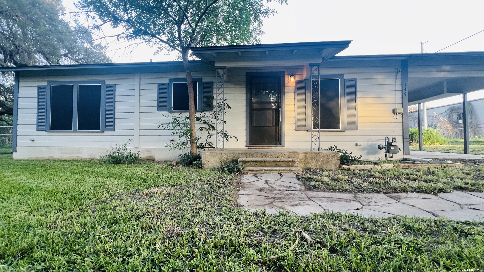 149 South Carroll Street Poth, TX 78147 - Photo 25 of 28 a front view of a house with garden