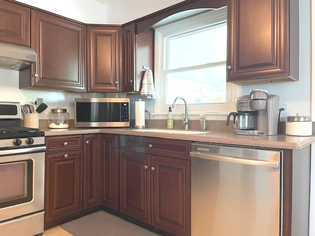 6118 Meyer Road Marengo, IL 60152 - Photo 11 of 42 a kitchen with stainless steel appliances granite countertop a sink stove and cabinets