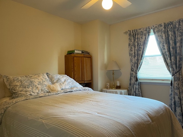 6118 Meyer Road Marengo, IL 60152 - Photo 16 of 42 a bedroom with a bed and a chandelier
