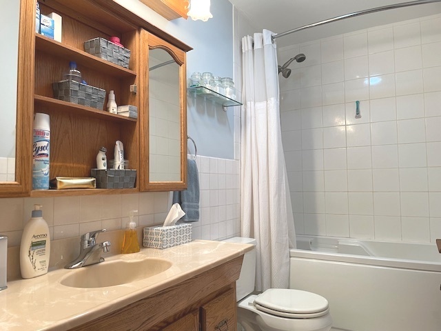 6118 Meyer Road Marengo, IL 60152 - Photo 17 of 42 a bathroom with a sink a toilet and shower