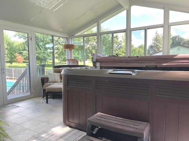 6118 Meyer Road Marengo, IL 60152 - Photo 29 of 42 a room with a balcony a bed and a chair