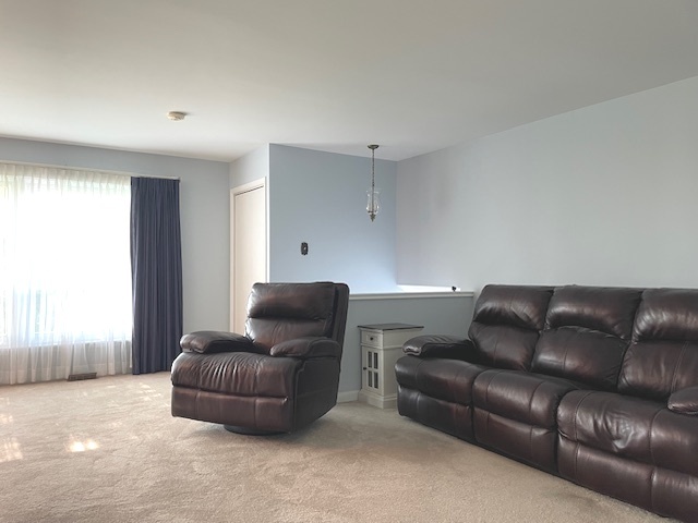 6118 Meyer Road Marengo, IL 60152 - Photo 3 of 42 a living room with a couch and a window
