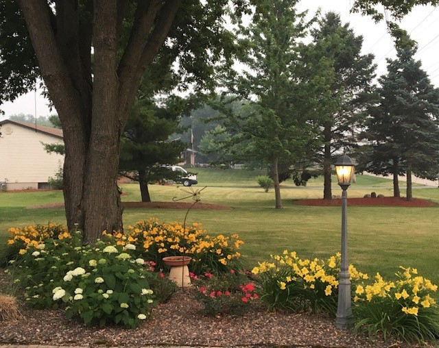 6118 Meyer Road Marengo, IL 60152 - Photo 35 of 42 a view of a lake with a table and chairs under an umbrella