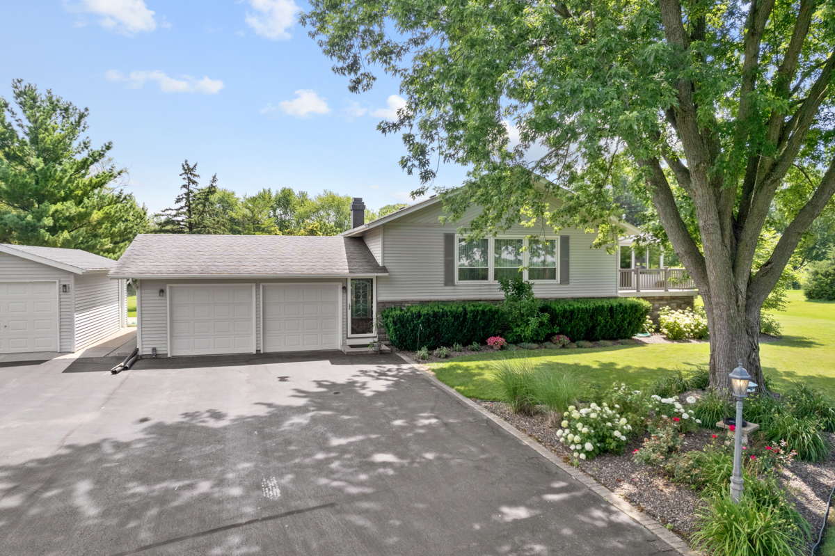6118 Meyer Road Marengo, IL 60152 - Photo 42 of 42 a front view of a house with a yard and a garage