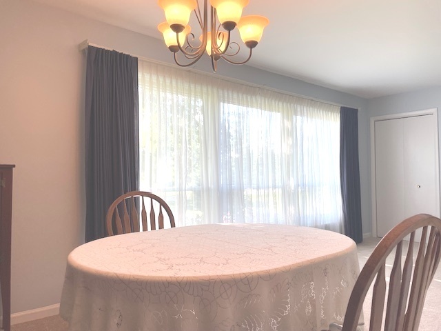 6118 Meyer Road Marengo, IL 60152 - Photo 5 of 42 a large bed sitting in a bedroom next to a window