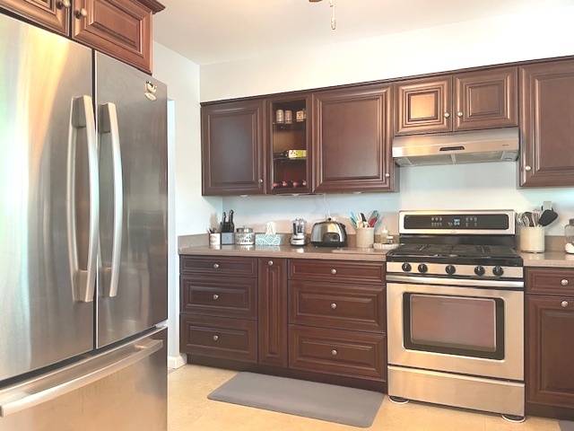 6118 Meyer Road Marengo, IL 60152 - Photo 9 of 42 a kitchen with stainless steel appliances granite countertop a refrigerator stove and a sink