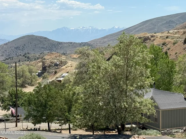 a view of a town with mountains in the background