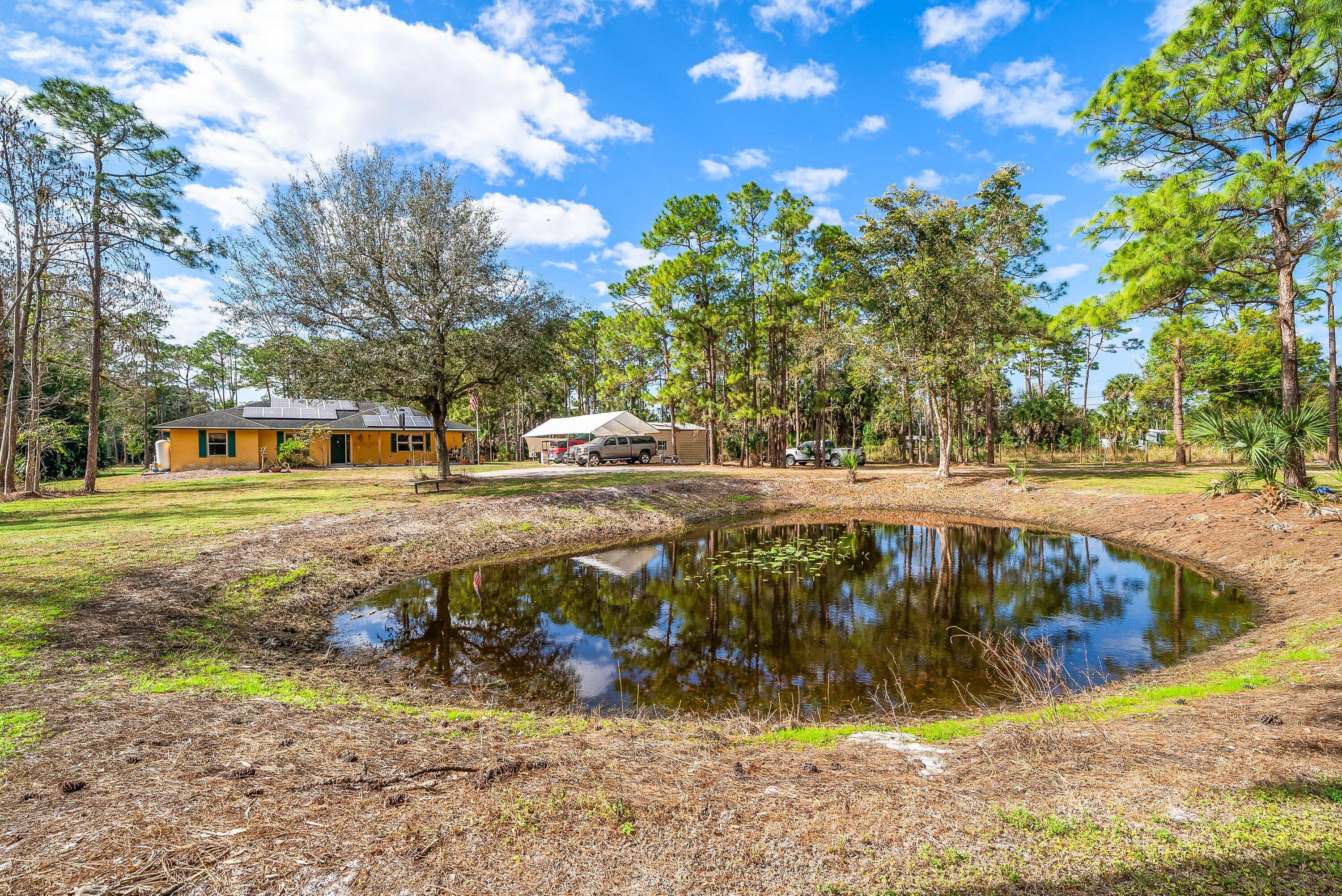 2195 F Road Loxahatchee Groves, FL 33470 - Photo 40 of 54 a view of a park with large trees