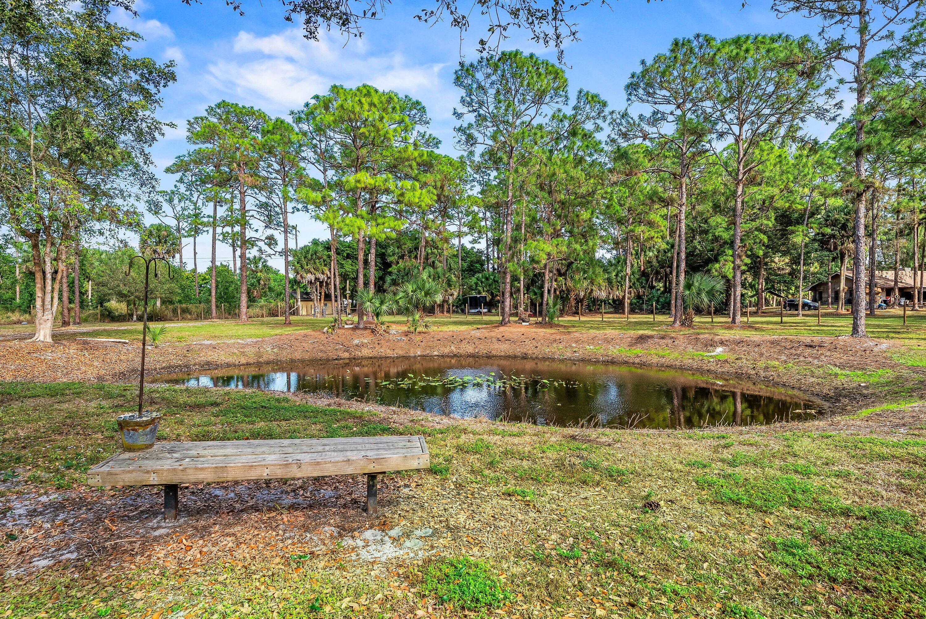 2195 F Road Loxahatchee Groves, FL 33470 - Photo 5 of 54 a view of a park with large trees