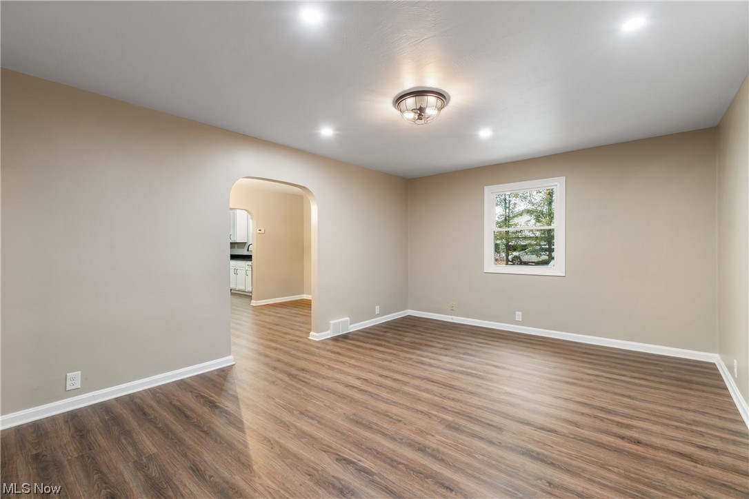 916 Renninger Road Akron, OH 44319 - Photo 12 of 31 Empty room with dark wood-type flooring