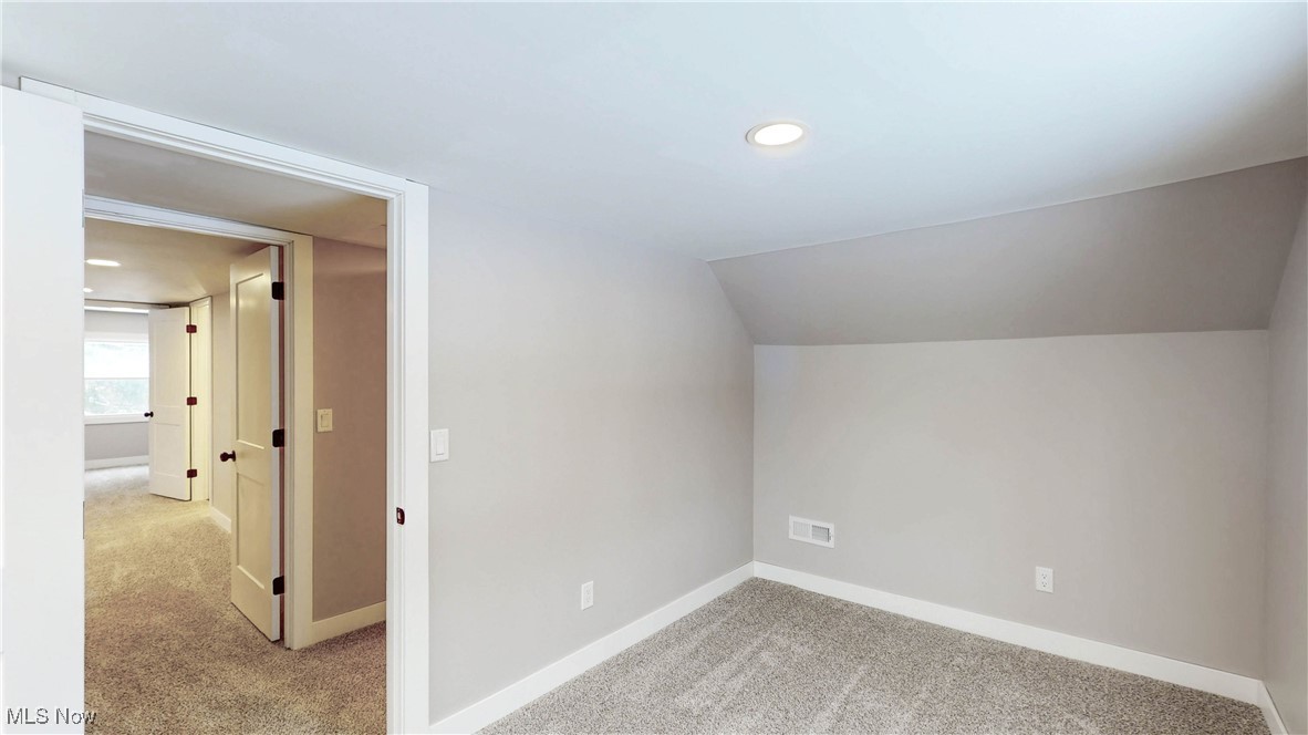 2978 Long Road Uniontown, OH 44685 - Photo 40 of 40 Additional living space featuring light carpet, recessed lighting, and lofted ceiling