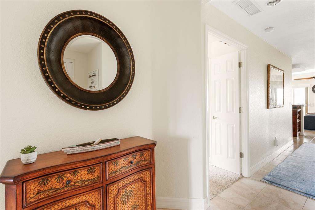 1420 Beach Road, Unit 204 Englewood, FL 34223 - Photo 11 of 99 a bathroom with a sink a mirror and a toilet