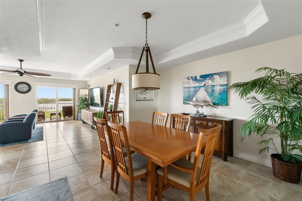 1420 Beach Road, Unit 204 Englewood, FL 34223 - Photo 13 of 99 a dining room with furniture and window