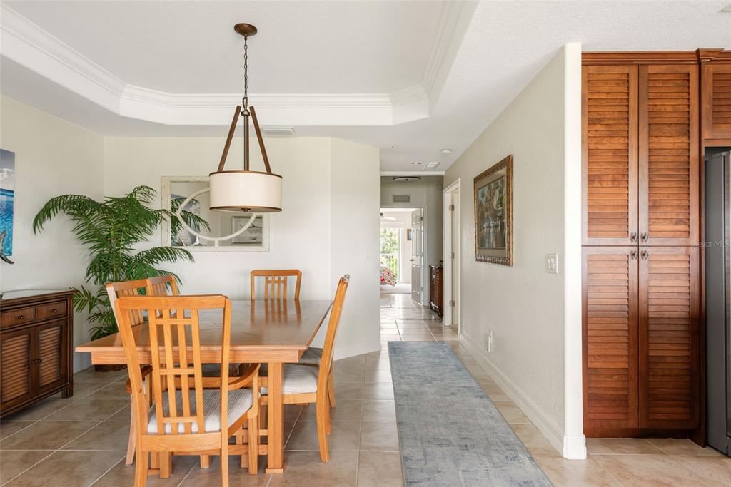 1420 Beach Road, Unit 204 Englewood, FL 34223 - Photo 15 of 99 a dining room with furniture and window