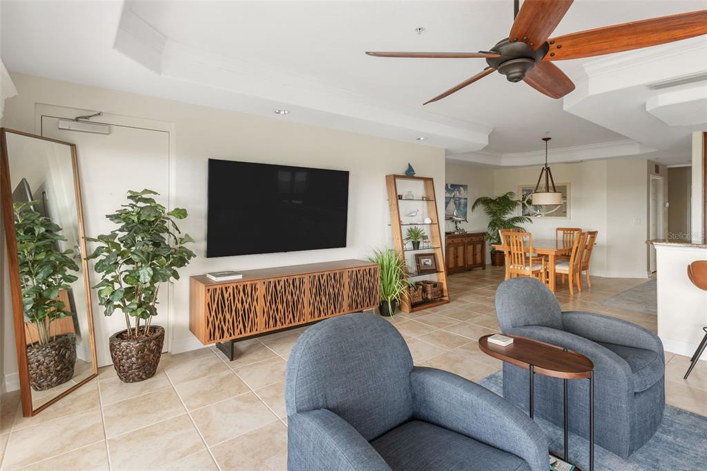 1420 Beach Road, Unit 204 Englewood, FL 34223 - Photo 25 of 99 a living room with furniture and a flat screen tv