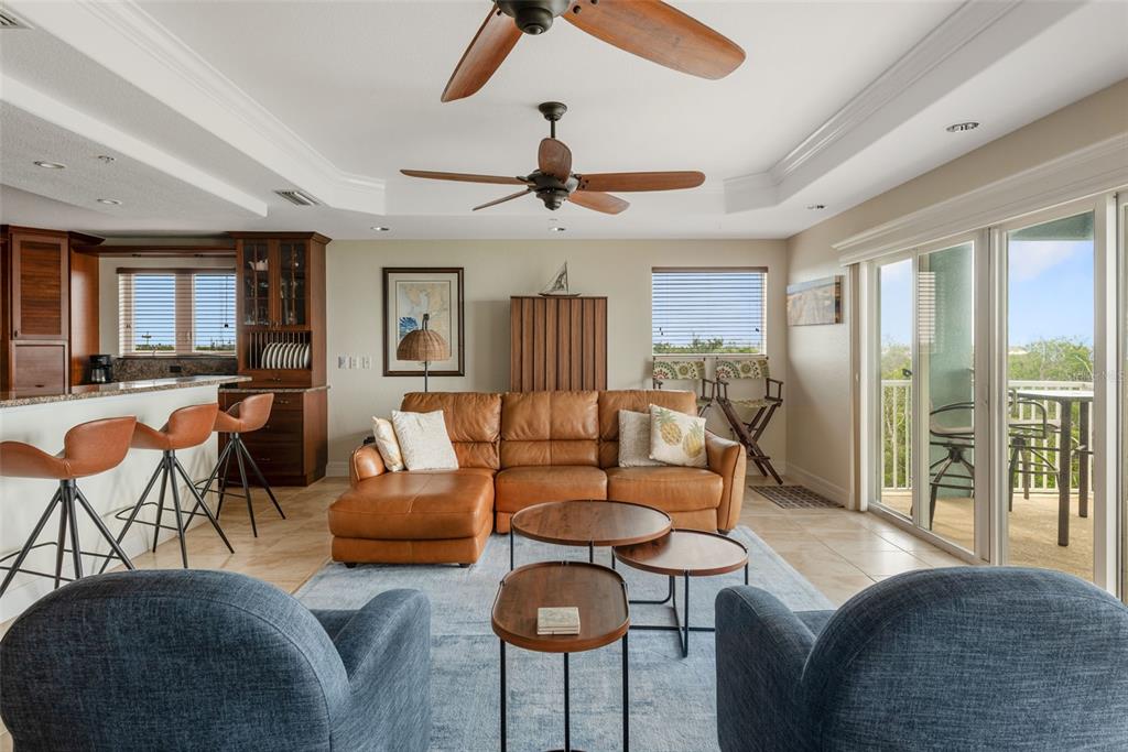 1420 Beach Road, Unit 204 Englewood, FL 34223 - Photo 27 of 99 a living room with furniture and a large window