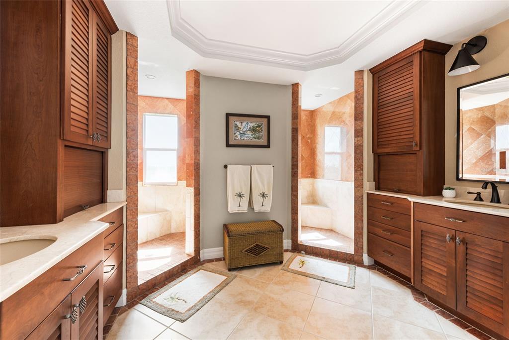 1420 Beach Road, Unit 204 Englewood, FL 34223 - Photo 37 of 99 a spacious bedroom with a bed and a dresser next to a window